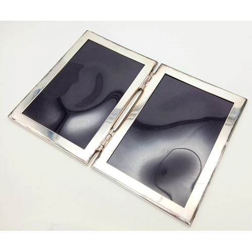 219 - A RALPH LAUREN STERLING SILVER DOUBLE PHOTO FRAME 208.5G TOTAL WEIGHT, 11CM x 8CM. REF: JB 5001