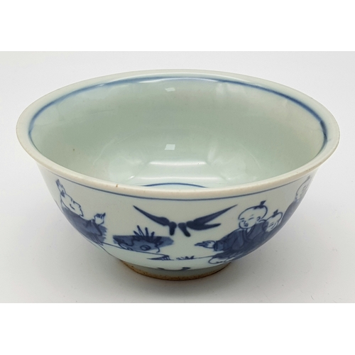 220 - A Chinese, blue and white hand painted bowl decorated with children playing with birds and signature... 