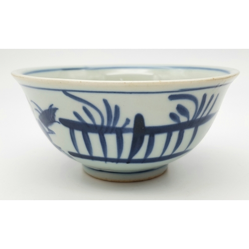 220 - A Chinese, blue and white hand painted bowl decorated with children playing with birds and signature... 