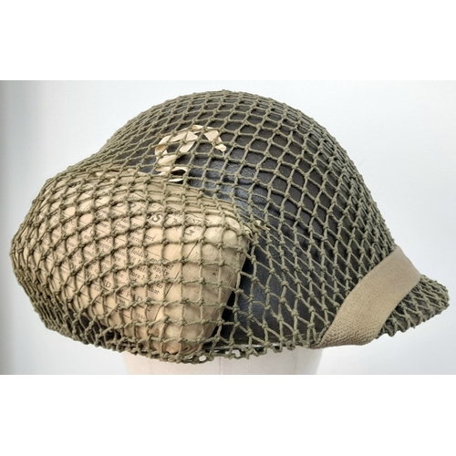 61 - A WW2 British Mk III 1944 “Turtle Pattern D-Day” Helmet. With the light blue Insignia of the Irish G... 