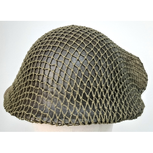 61 - A WW2 British Mk III 1944 “Turtle Pattern D-Day” Helmet. With the light blue Insignia of the Irish G... 