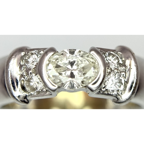 71 - AN 18K WHITE GOLD DIAMOND RING 0.35CT OVAL CENTRE WITH ACCENTED DIAMONDS TOTAL DIAMOND WEIGHT 0.51CT... 