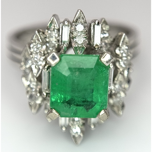 85 - A 14K WHITE GOLD DIAMOND & EMERALD RING 7.2G TOTAL WEIGHT, SIZE O 1/2. REF: TAN 5009 AS SIL