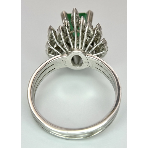 85 - A 14K WHITE GOLD DIAMOND & EMERALD RING 7.2G TOTAL WEIGHT, SIZE O 1/2. REF: TAN 5009 AS SIL