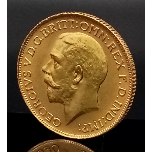 167 - A 1925 GEORGE V FULL SOVEREIGN COIN. 22K GOLD. C-5006.