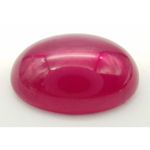 178 - A spectacular STAR RUBY, oval cabochon shaped, lab created, with vivid colour saturation, strong rea... 