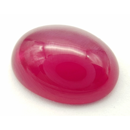 178 - A spectacular STAR RUBY, oval cabochon shaped, lab created, with vivid colour saturation, strong rea... 