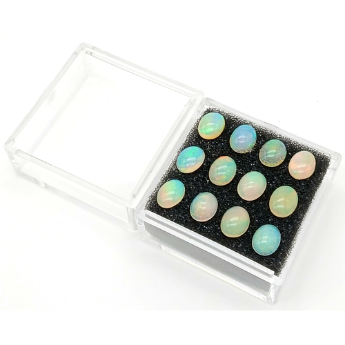 206 - A dozen of top quality, Australian, oval cabochon OPALS, dimensions: 9 x 7 mm, exhibiting excellent ... 