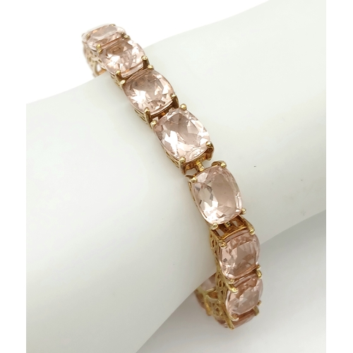 403 - A Yellow Gold Gilt Sterling Silver Morganite Set Tennis Bracelet. 18.5cm Length. Set with Sixteen 9m... 