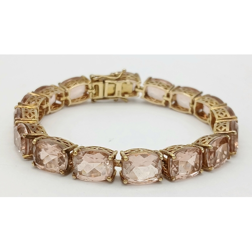 403 - A Yellow Gold Gilt Sterling Silver Morganite Set Tennis Bracelet. 18.5cm Length. Set with Sixteen 9m... 