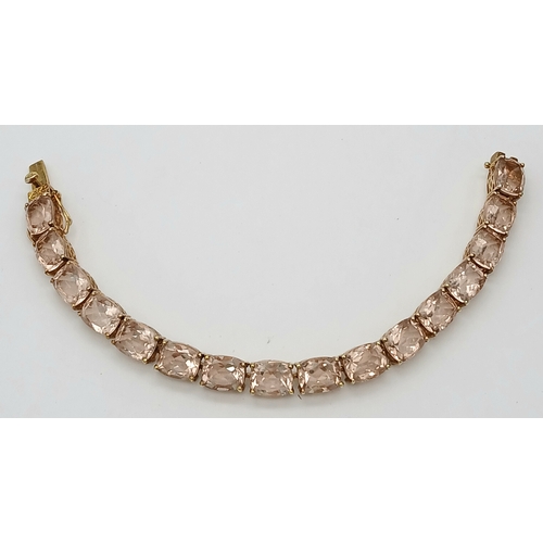 403 - A Yellow Gold Gilt Sterling Silver Morganite Set Tennis Bracelet. 18.5cm Length. Set with Sixteen 9m... 