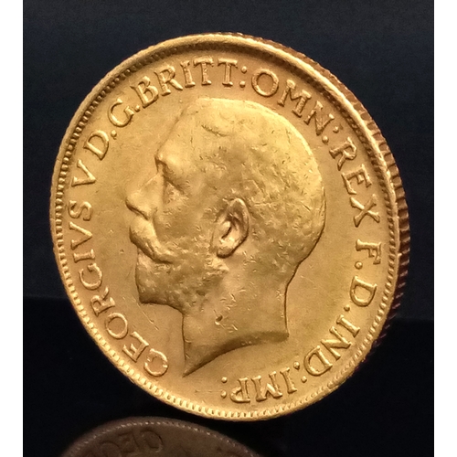 109 - A 1911 GEORGE V FULL SOVEREIGN COIN. 22K GOLD. VF/EF. C-5021