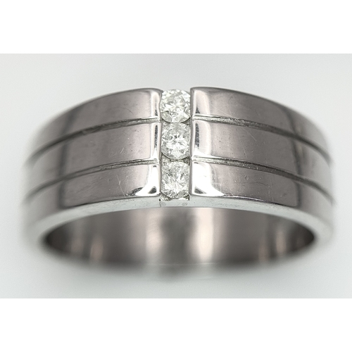 401 - A 9k white gold diamond band ring - 0.15ctw diamonds. 8.2g total weight. Size S. 2327H.