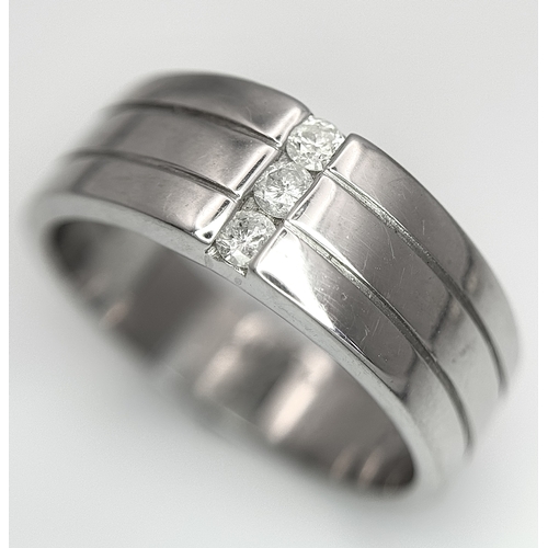 401 - A 9k white gold diamond band ring - 0.15ctw diamonds. 8.2g total weight. Size S. 2327H.