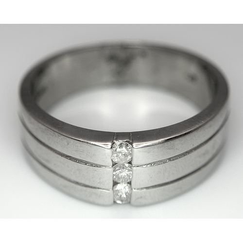 401 - A 9k white gold diamond band ring - 0.15ctw diamonds. 8.2g total weight. Size S. 2327H.