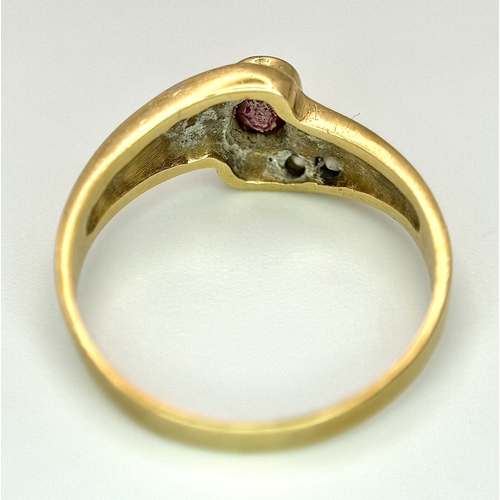 142 - A 14K Yellow Gold Red and White Stone Crossover Ring. Size O 1/2. 2.75g