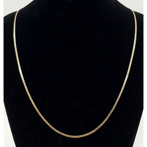 413 - Classic 9 CARAT GOLD  CHAIN NECKLACE. Flat and slim curb chain style. Approx 3.2 grams. 50 cm. (20”)... 