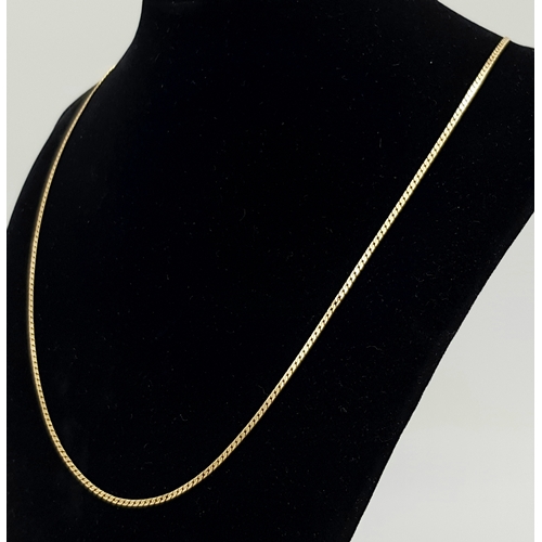 413 - Classic 9 CARAT GOLD  CHAIN NECKLACE. Flat and slim curb chain style. Approx 3.2 grams. 50 cm. (20”)... 