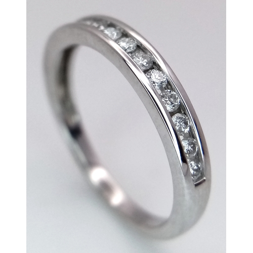 156 - AN 18K WHITE GOLD DIAMOND HALF ETERNITY RING - 0.28CTW.  2.5G. SIZE M. SC5083.