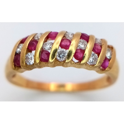 177 - AN 18K YELLOW GOLD DIAMOND & RUBY RING - 0.20CTW. 3.3G. SIZE T. SC5098.