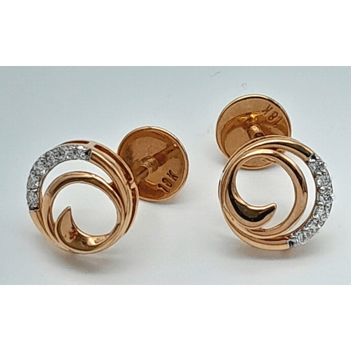 191 - A PAIR OF 18K ROSE GOLD DIAMOND SET SWIRL STUD EARRINGS. 2.1G. SC5092.