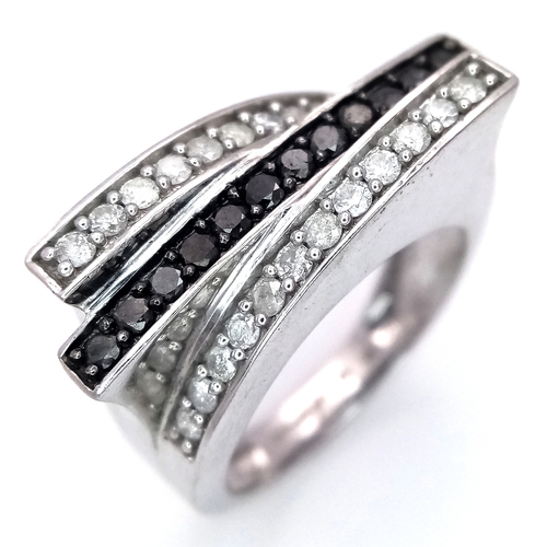 223 - A 9K WHITE GOLD 3 ROW DIAMOND RING - BLACK AND WHITE DIAMONDS. 5.8G. SIZE N. SC5039