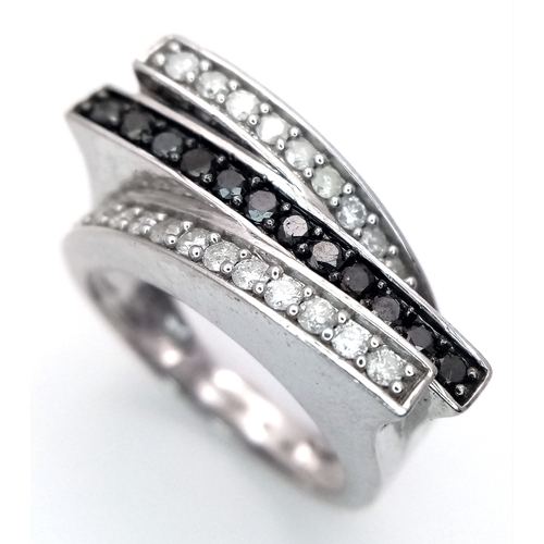 223 - A 9K WHITE GOLD 3 ROW DIAMOND RING - BLACK AND WHITE DIAMONDS. 5.8G. SIZE N. SC5039