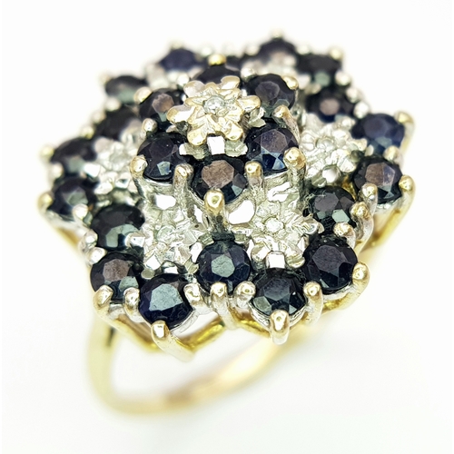 230 - A 9K YELLOW GOLD DIAMOND & SAPPHIRE SET CLUSTER RING. 5G. SIZE U. SC5037.