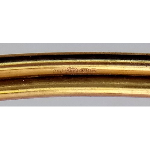 128 - An Italian 9K Yellow Gold Ball Bangle. 4.2g