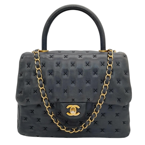 138 - A Chanel Lambskin Cross Stitch Coco Handle Flap Bag. Dark blue lambskin leather exterior with X-patt... 