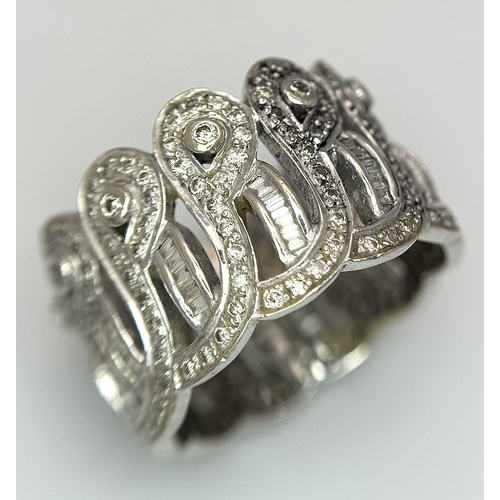 186 - An 18K White Gold and Diamond Crown Band Ring. Regal in nature with round and baguette cut diamonds ... 