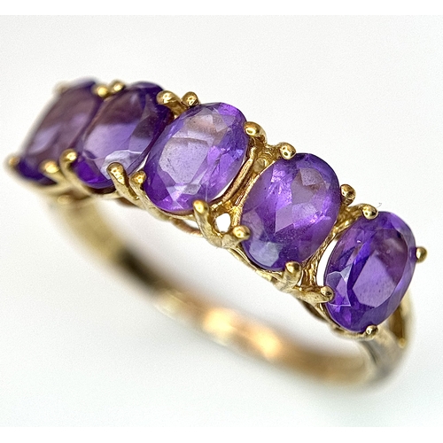 37 - A 9K Yellow Gold Five Stone Amethyst Ring. Size L. 2g.