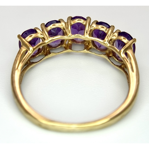 37 - A 9K Yellow Gold Five Stone Amethyst Ring. Size L. 2g.