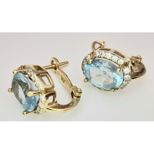 72 - A Pair of 14K Yellow Gold, Aquamarine and White Zircon Earrings. 4.08g.