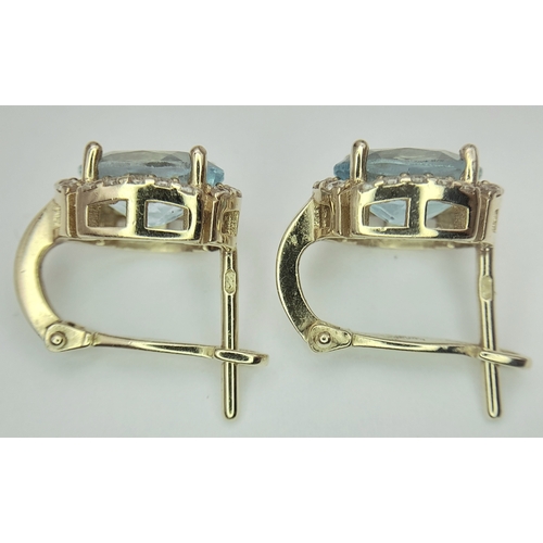 72 - A Pair of 14K Yellow Gold, Aquamarine and White Zircon Earrings. 4.08g.