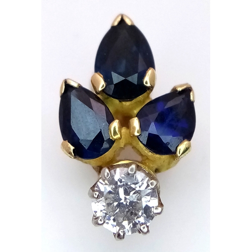 556 - An 18K Gold (tested) Sapphire and Diamond Pendant. 0.40ct round brilliant cut. 17mm. 1.8g