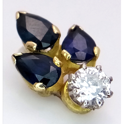 556 - An 18K Gold (tested) Sapphire and Diamond Pendant. 0.40ct round brilliant cut. 17mm. 1.8g