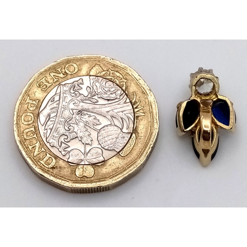 556 - An 18K Gold (tested) Sapphire and Diamond Pendant. 0.40ct round brilliant cut. 17mm. 1.8g