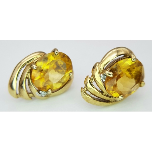 86 - A Pair of Abstract Citrine and Diamond earrings. 17mm. 3.05g