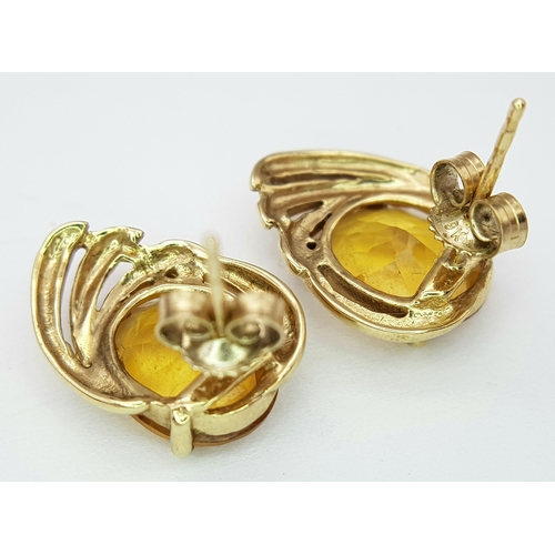 86 - A Pair of Abstract Citrine and Diamond earrings. 17mm. 3.05g