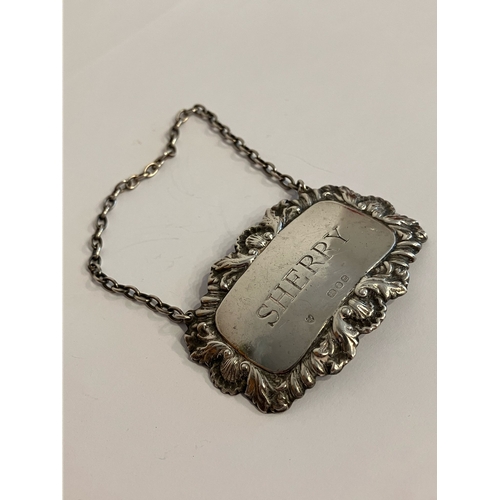 1340 - Vintage SILVER ‘SHERRY’ DECANTER LABEL. Complete with silver chain .Having attractive Shell and Leaf... 