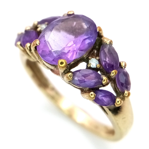 51 - A 9K Yellow Gold, Amethyst and Diamond Ring. Size L. 3.37g