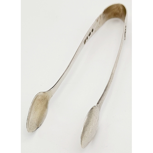 1688 - An antique pair of sterling silver sugar tongs. Full Birmingham hallmarks, 1907. Total weight 12.7G.... 