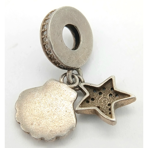 1635 - A Pandora 925 silver Starfish & Sea Shell dangle pendant/charm. Total weight 2.9G.