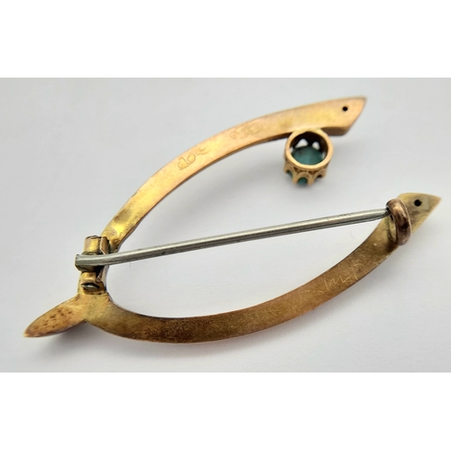 83 - An Antique 9K Rose Gold and Turquoise Wishbone brooch. Pin has been replaced. 4cm. 1.55g