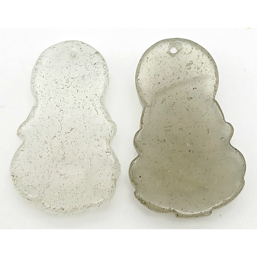 1209 - Two Clearstone Buddha Pendants. 4cm.