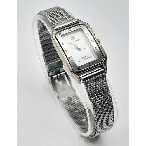 1183 - A Ladies Calvin Klein Tank Style Quartz Watch on a Milanese Bracelet. The Case Measures 30 x 20mm. N... 