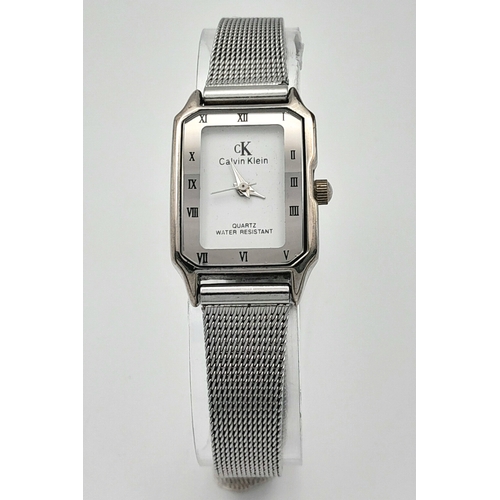 1183 - A Ladies Calvin Klein Tank Style Quartz Watch on a Milanese Bracelet. The Case Measures 30 x 20mm. N... 