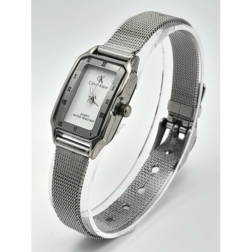 1183 - A Ladies Calvin Klein Tank Style Quartz Watch on a Milanese Bracelet. The Case Measures 30 x 20mm. N... 