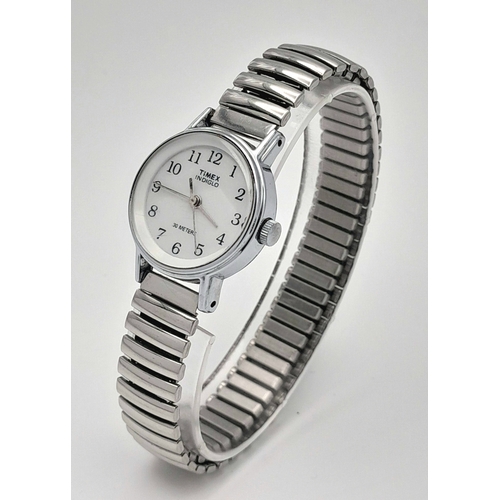 1309 - A Stylish Ladies Timex Indiglo Quartz Watch. 23mm Case. New Battery Fitted February 2025. Flex Brace... 